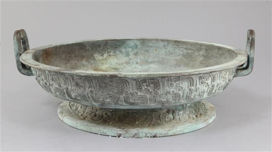 A Chinese archaic bronze ritual water basin, Pan, early Eastern Zhou dynasty, 8th-7th century B.C., 15cm high, 40.5cm, old repairs